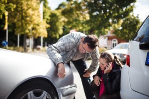 looking at car accident damage