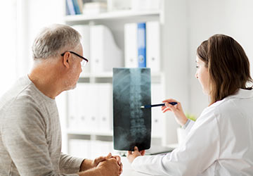 doctor reviewing spinal cord injury