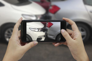 taking a picture for insurance after a car accident in Montgomery, AL