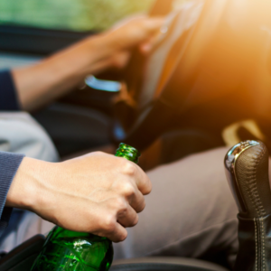 drinking driving man holding alcohol bottle