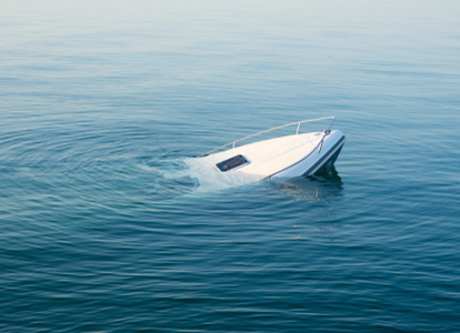 large white boat sinking