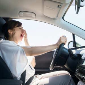 female driver falling asleep