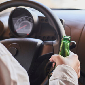 a person drinking while driving