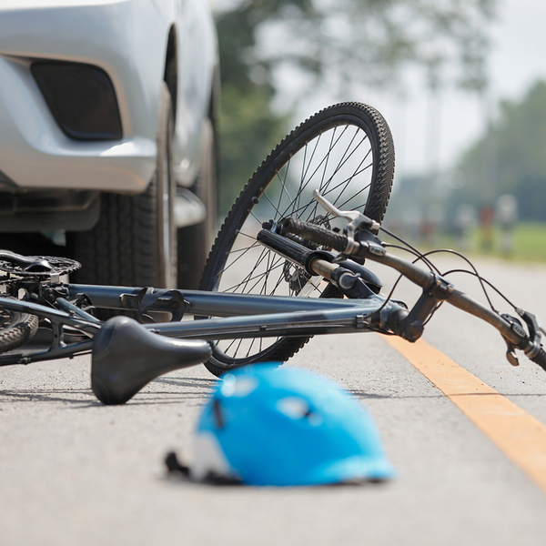 car accident and bicycle on road