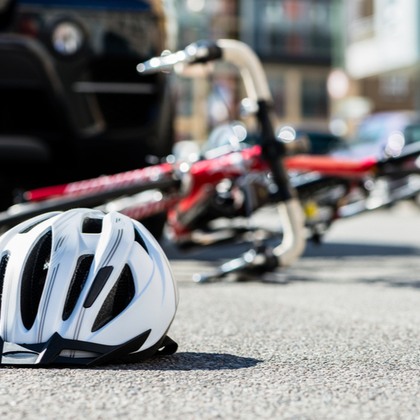 bicycling helmet fallen on asphalt