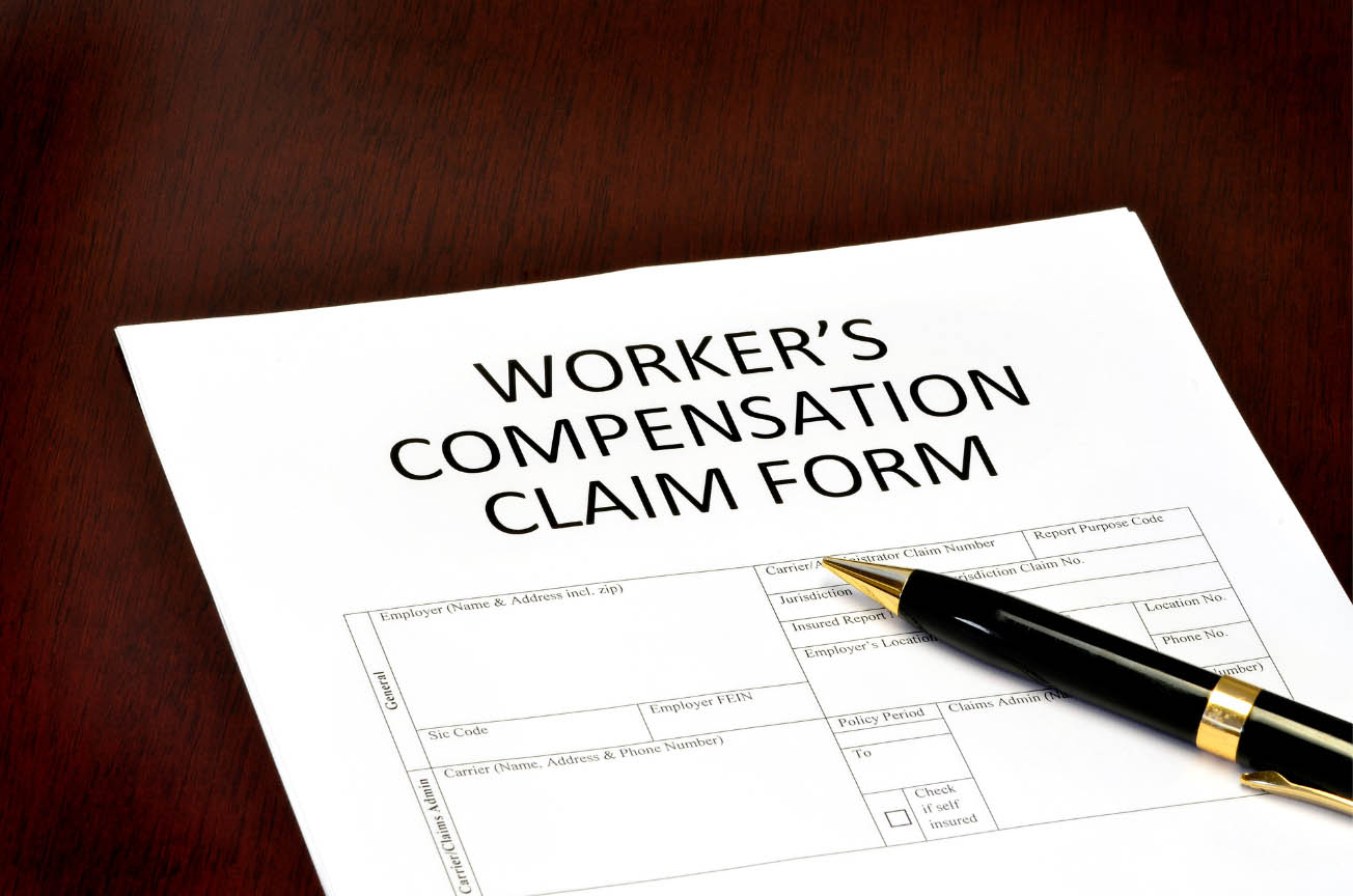 Pen on top of a workers' compensation claim form
