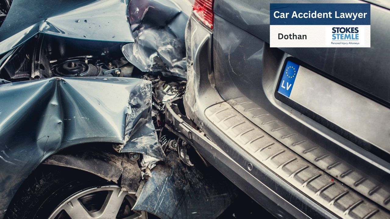 The image depicts the aftermath of a severe car accident, highlighting extensive damage to two vehicles.